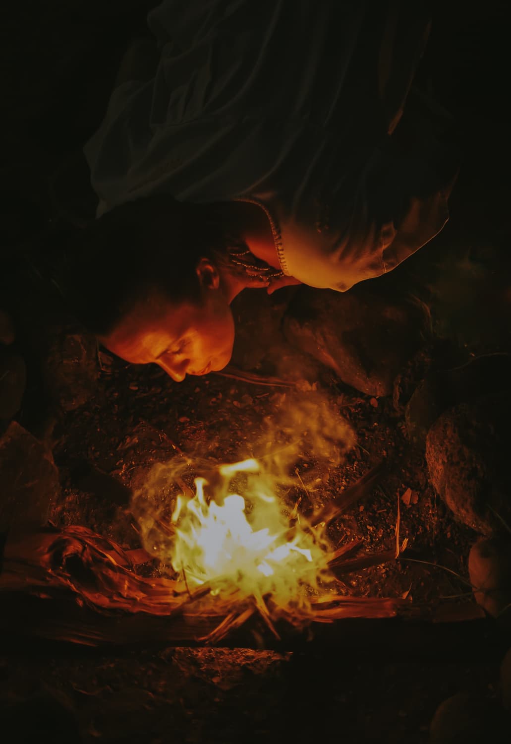 Anna Maria tending the sacred fire